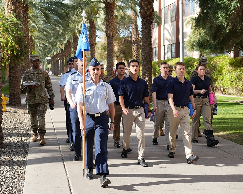 Air Force cadets march through Palm Walk on ASU's Tempe campus.